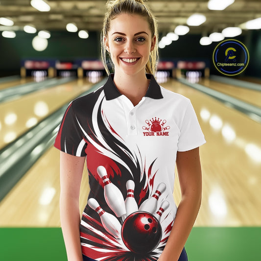 Front view of a female model wearing a white, black, and red bowling polo shirt with a flaming bowling ball hitting the pins illustration inside a bowling lane.