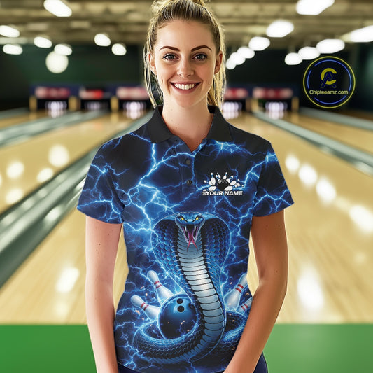 Female model wearing a bowling polo in a bowling alley with blue cobra graphics and a lightning background.
