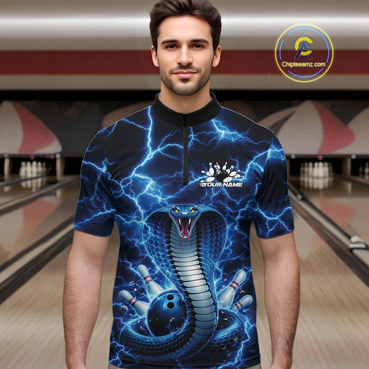 Male model at the bowling lane wearing a quarter-zip with blue cobra and bowling ball graphics against lightning.