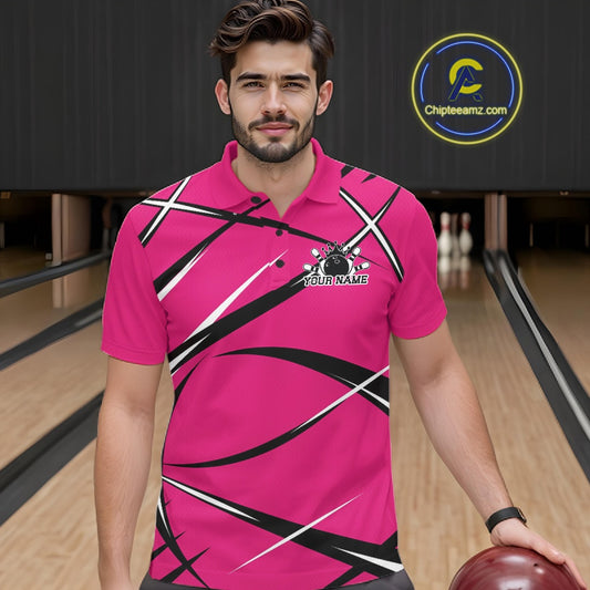 Front view of a male bowler wearing a pink, black, and white bowling polo shirt in a bowling lane