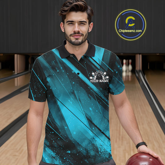 Man wearing a blue and black bowling shirt with a logo in a bowling alley.
