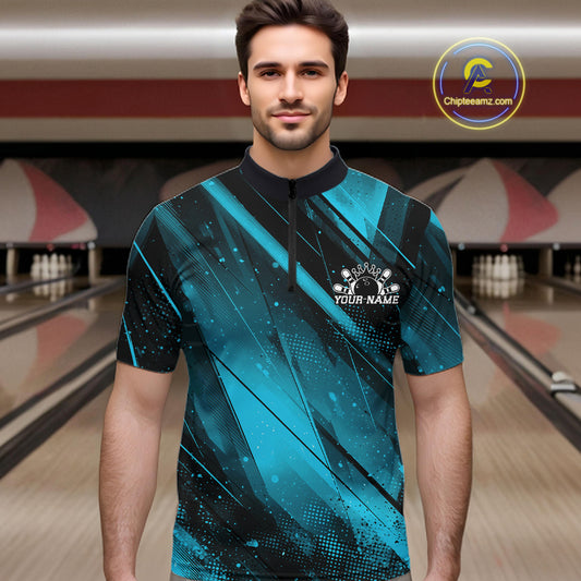 Man wearing a blue and black bowling shirt with a personalized design in a bowling alley.