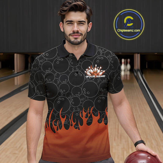 Front view of a male model in a bowling lane wearing a black polo shirt with vibrant orange flames and bowling ball pattern with flaming bowling action design.