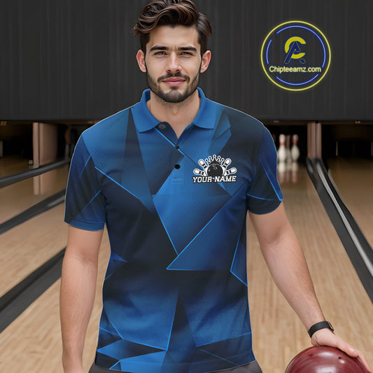 Man wearing a blue bowling shirt with a logo and text in a bowling alley.