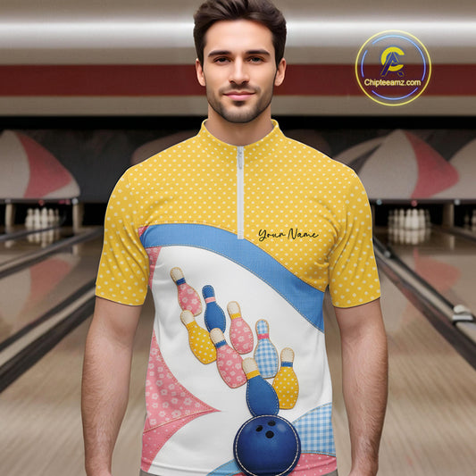 Male model at a bowling lane wearing a quarter-zip bowling shirt with vibrant patchwork bowling ball and pin graphics accented by polka dots.