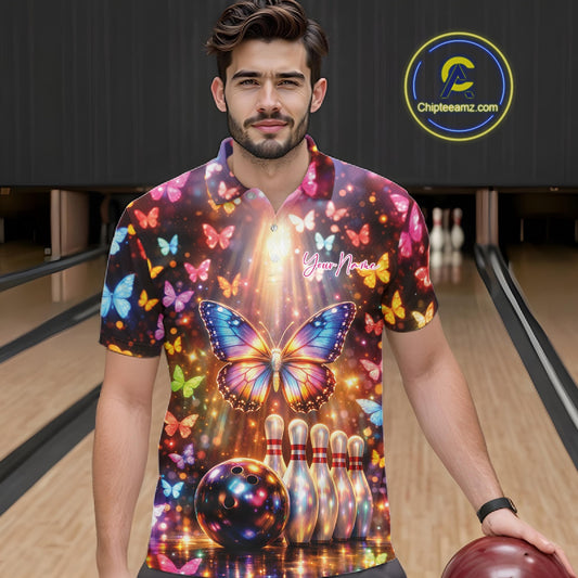Male model wearing a bowling polo shirt at the bowling lane with colorful butterfly artwork, bowling pins, a bowling ball, and sparkling details.