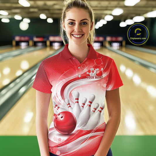 Female model wearing a white and red bowling polo shirt with sweeping wave artwork and a bowling ball knocking down pins at the bowling lane