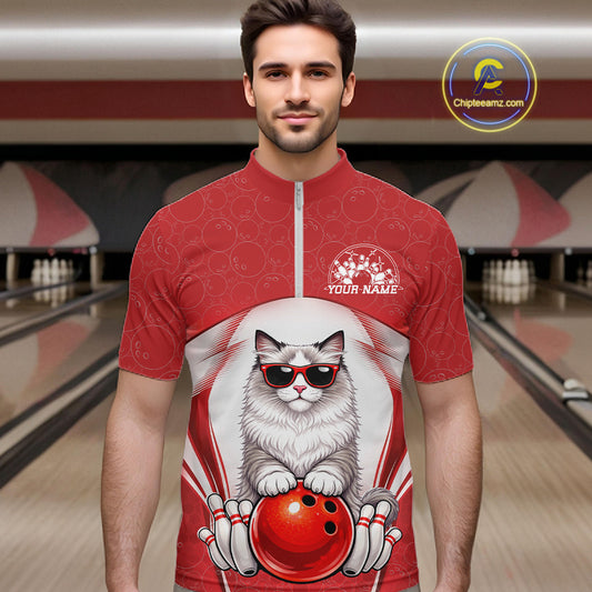 Male model wearing a bowling quarter-zip shirt at a bowling lane with a ragdoll cat in sunglasses and bowling ball artwork.