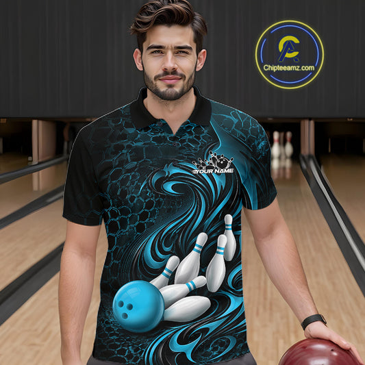 Male model standing in a bowling lane wearing a black and blue bowling polo shirt featuring a tribal flame bowling ball and pins graphic on the front.