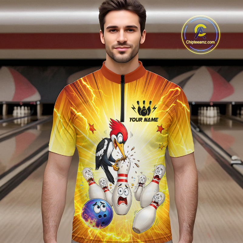 Man wearing a bowling-themed shirt with cartoon characters in a bowling alley.
