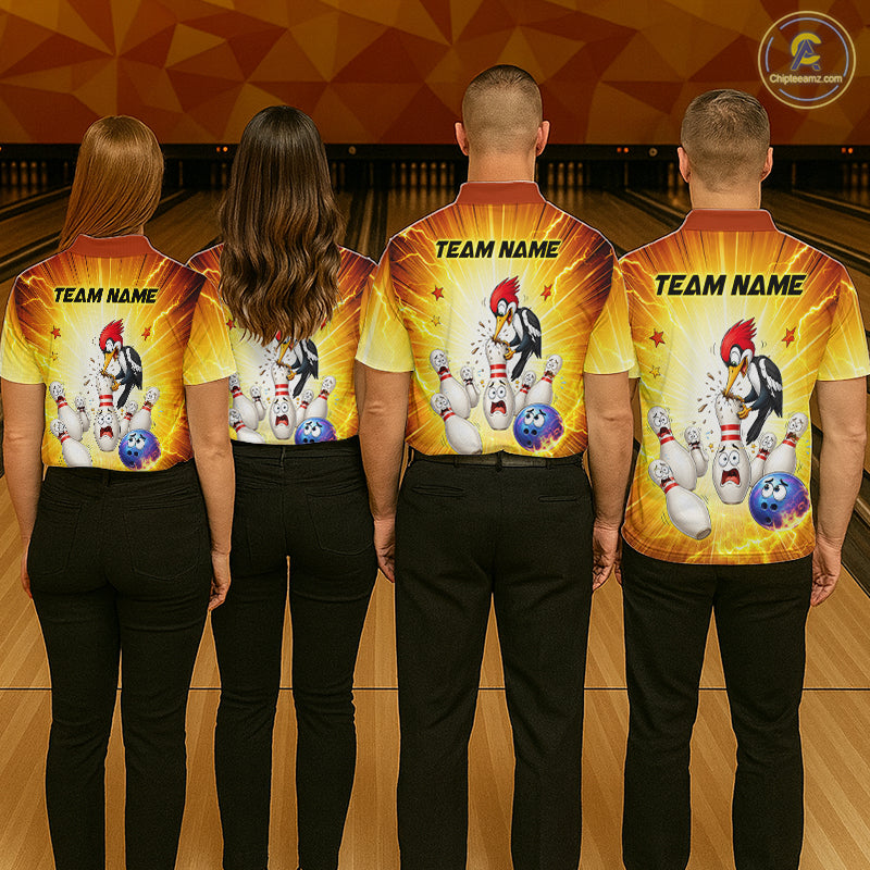 Four people wearing matching bowling shirts with a cartoon character design on a bowling alley background.