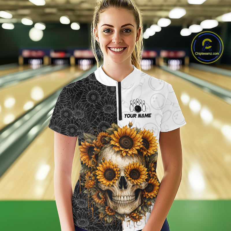 Person wearing a custom shirt with a skull and sunflower design in a bowling alley.