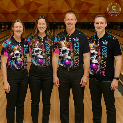 Four people wearing matching colorful shirts with skull designs on a bowling alley.