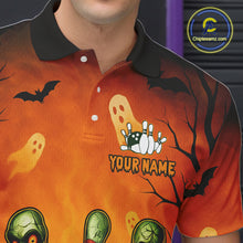 Load image into Gallery viewer, Orange Halloween-themed polo shirt with ghost, bat, and zombie design on a person wearing it.