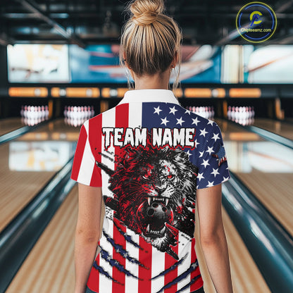Person wearing a shirt with an American flag design and a lion graphic in a bowling alley.