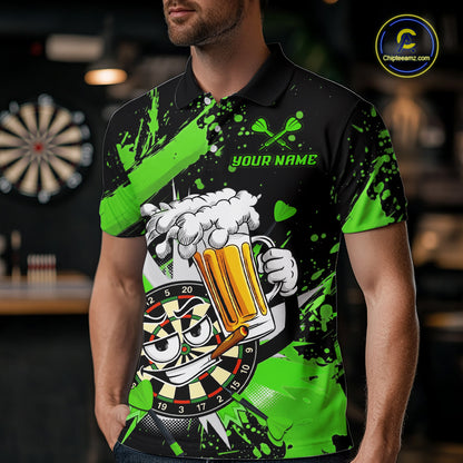 A man wearing a black and neon green short-sleeve polo shirt with a darts and beer-themed graphic print. The shirt features a cartoon dartboard face, a foaming beer mug, crossed darts, and the text 'YOUR NAME' on the chest.