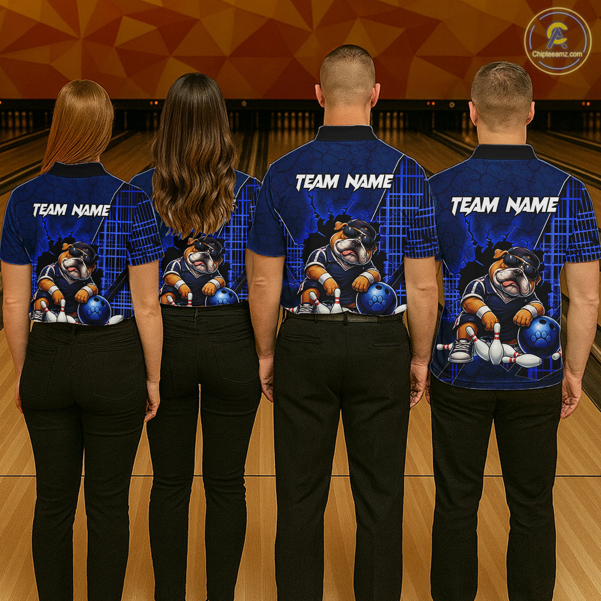 Four people standing with their backs to the camera in a bowling alley, wearing matching custom bowling shirts with a bulldog graphic and 'TEAM NAME' printed on the back.
