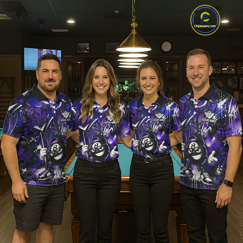 Four people wearing matching purple bowling shirts in a bowling alley.