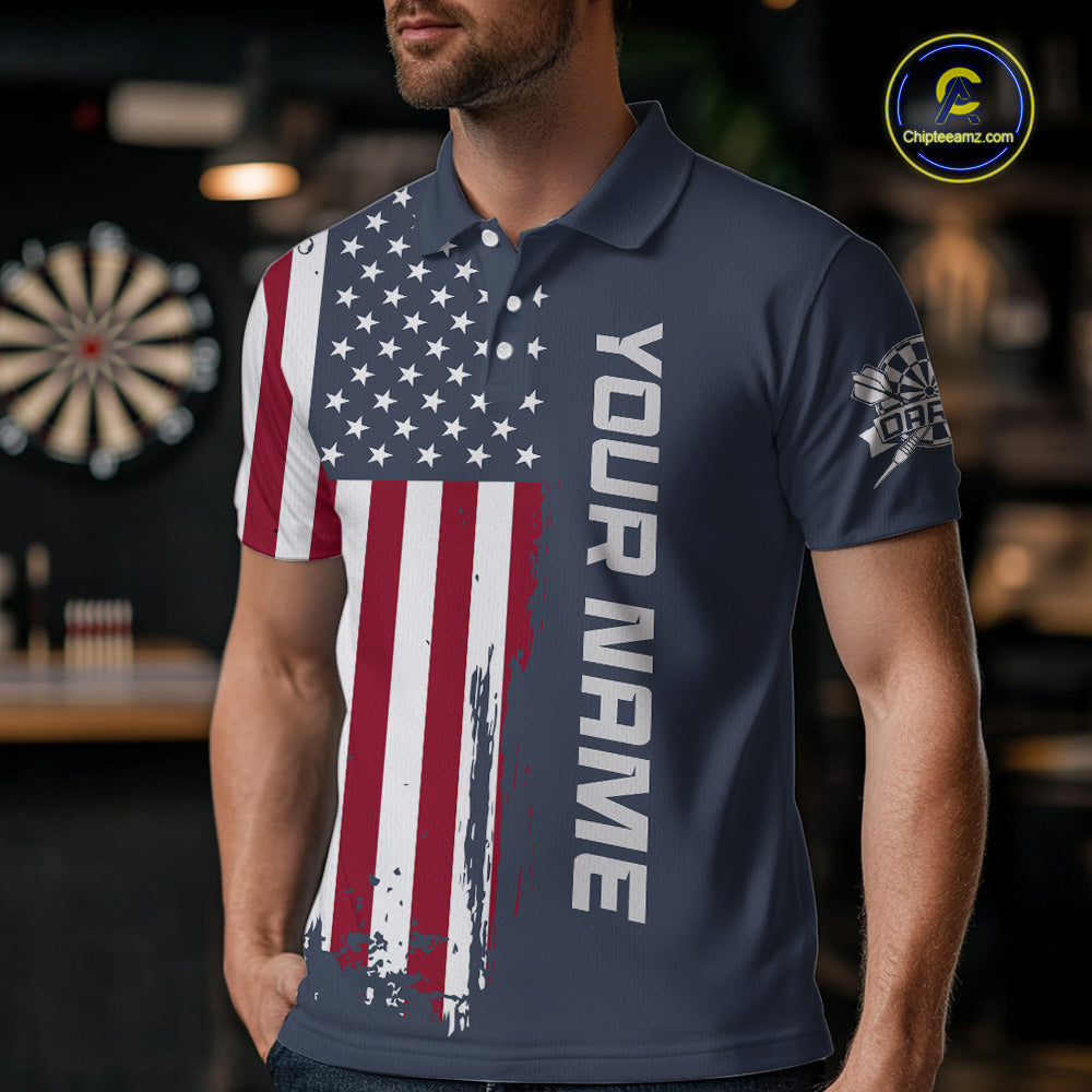 Man wearing a custom navy dart polo shirt featuring a distressed American flag graphic in a professional dart room.