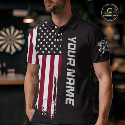A man wearing a custom brown dart polo shirt featuring a distressed American flag graphic in a professional dart room.
