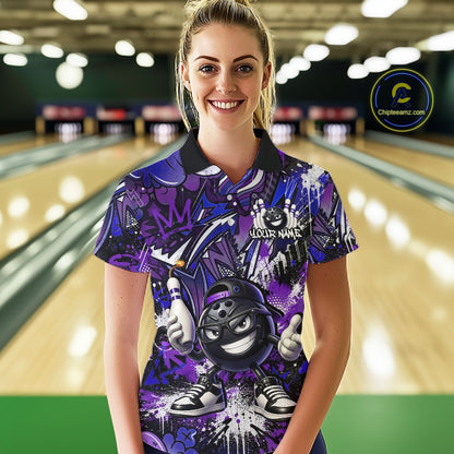 Woman wearing a colorful bowling shirt with a graphic design in a bowling alley.