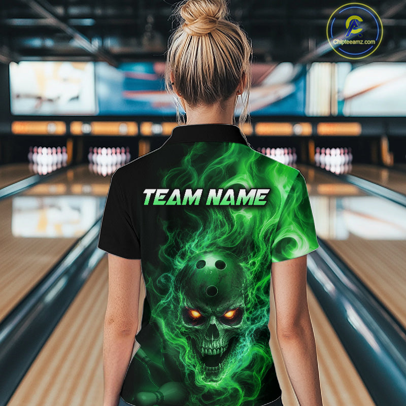 Woman wearing a black bowling polo shirt featuring a flaming skull with glowing orange eyes, green smoke effects, and custom “TEAM NAME” text.