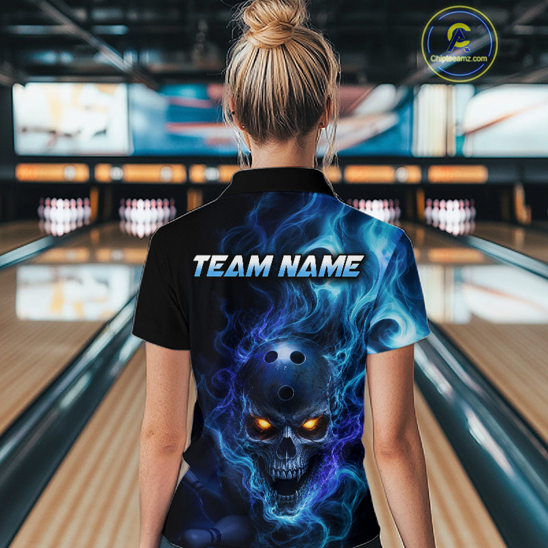 Woman wearing a black bowling quarter zip shirt featuring a flaming skull with glowing orange eyes, blue smoke effects, and custom “TEAM NAME” text.