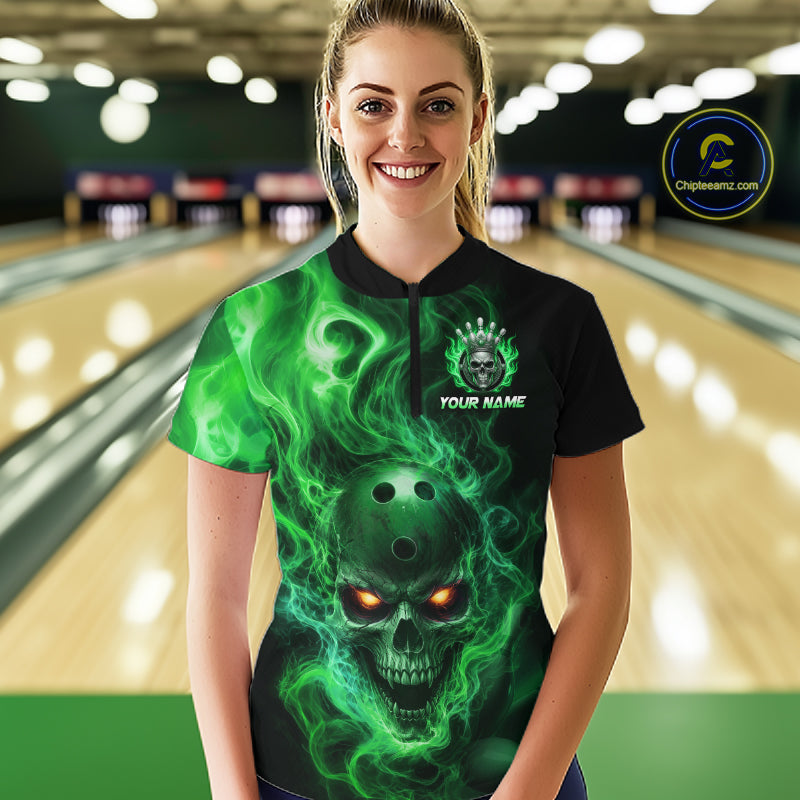 Women wearing a black bowling quarter zip shirt featuring a flaming skull with glowing orange eyes, green smoke effects, and custom “YOUR NAME” text.