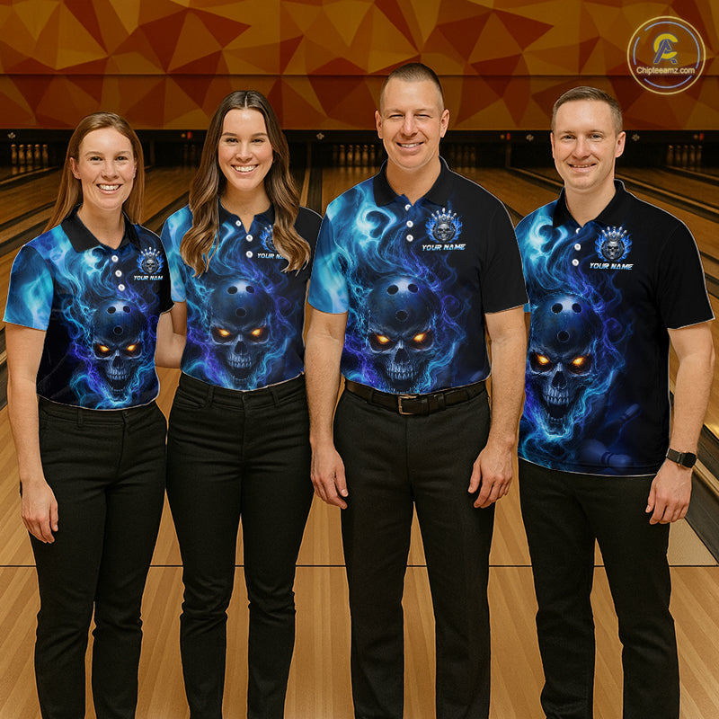 Four people wearing a black bowling polo shirt featuring a flaming skull with glowing orange eyes, blue smoke effects, and custom “YOUR NAME” text.