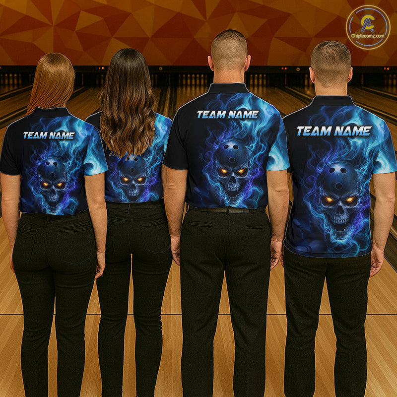 Four people wearing a black bowling polo shirt featuring a flaming skull with glowing orange eyes, blue smoke effects, and custom “TEAM NAME” text.