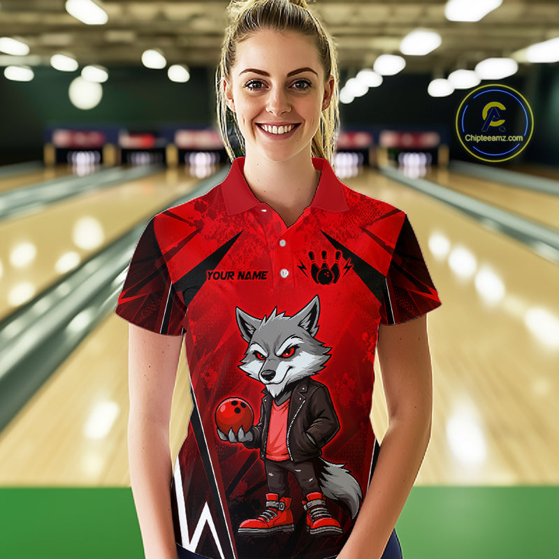Woman wearing a red and black bowling polo shirt featuring a gray wolf mascot holding a red bowling ball, with custom player name text.