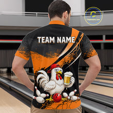 Load image into Gallery viewer, Man wearing a orange and black bowling quarter zip featuring a chicken holding a beer mug, red bowling ball, scattered pins, and custom team name text.