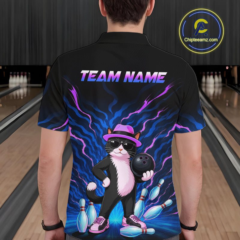 A person shown from the back wearing a black short-sleeve bowling-themed shirt with a colorful graphic of a cat in a hat holding a bowling ball, surrounded by bowling pins and blue lightning effects. The shirt has 'TEAM NAME' printed across the upper back.