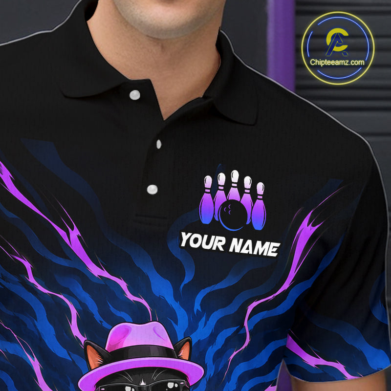 A close-up of a person wearing a black short-sleeve polo shirt with a custom bowling-themed graphic. The design features purple and blue flame-like swirls, a bowling pins and ball graphic above the text 'YOUR NAME', and a cat wearing a pink hat at the bottom.