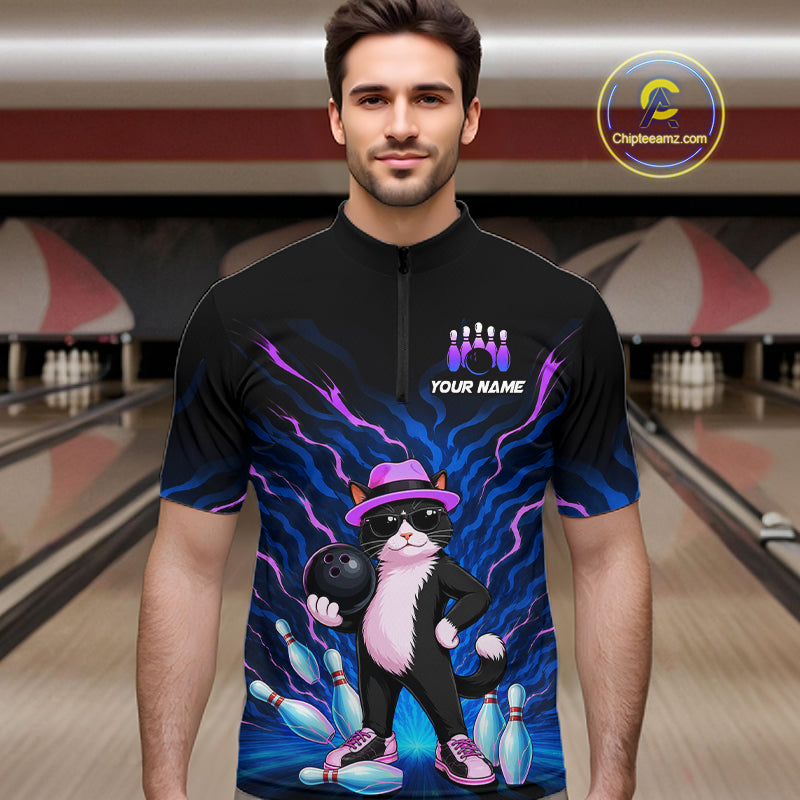 A man wearing a black short-sleeve quarter-zip bowling-themed graphic shirt with a cartoon cat holding bowling pins and bowling balls, set against a bowling alley background. A circular 'Chipteamz.