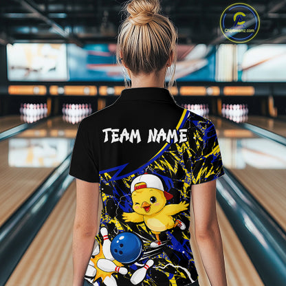 Person wearing a colorful bowling shirt with a chicken design in a bowling alley.