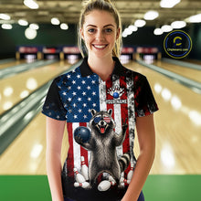 Load image into Gallery viewer, Women’s us flag raccoon bowling polo shirt, front view on female model in bowling lane 