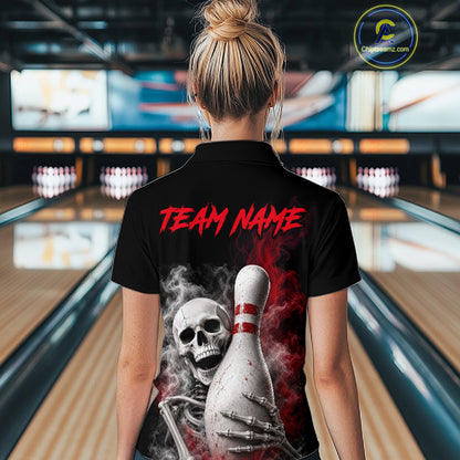 A woman viewed from behind wearing a black short-sleeve polo shirt with a large back graphic. The graphic shows a white bowling pin, a skull, skeletal hands, red smoke, and the text 'TEAM NAME' in red.