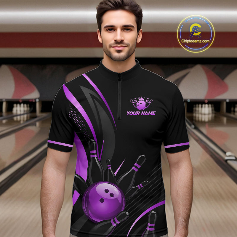 Man wearing a black and purple bowling shirt with a personalized logo in a bowling alley.