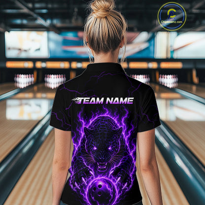 Person wearing a black shirt with a purple panther design and 'TEAM NAME' text in a bowling alley.