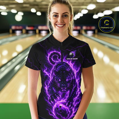 Woman wearing a black t-shirt with a purple panther design in a bowling alley.