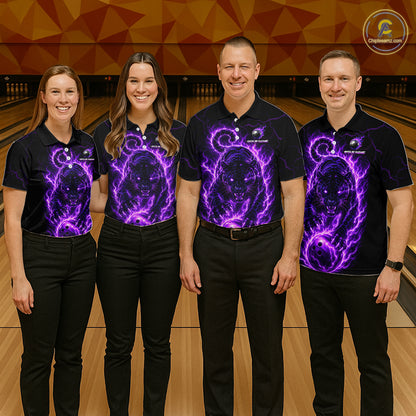 Four people wearing black shirts with purple graphics on a bowling alley.