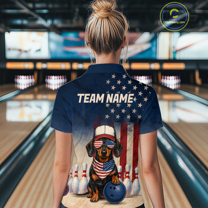 Person wearing a shirt with a dog graphic and 'Team Name' text in a bowling alley.
