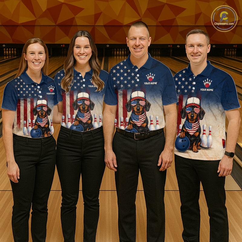 Four people wearing matching bowling shirts with a dachshund design on a bowling alley.