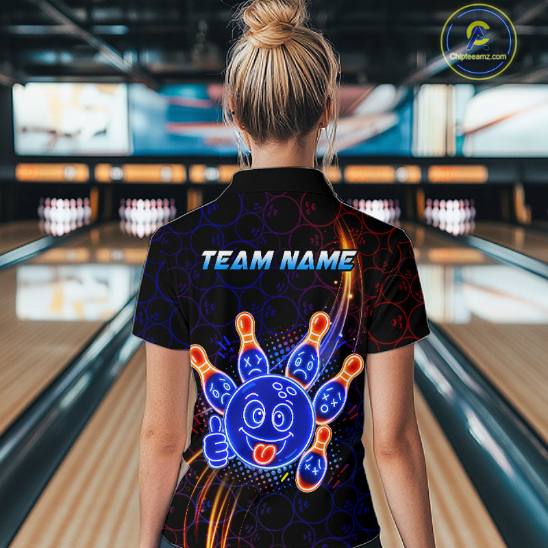 Woman wearing of a black bowling quarter zip shirt with neon blue and orange cartoon bowling ball and pin graphics, plus custom team name text.