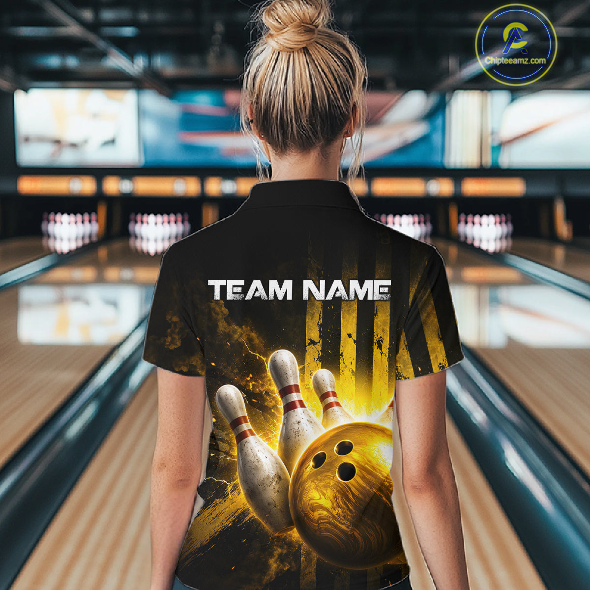 Person wearing a bowling-themed shirt with 'TEAM NAME' text in a bowling alley.
