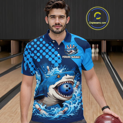 Man wearing a blue bowling shirt with a shark design in a bowling alley.