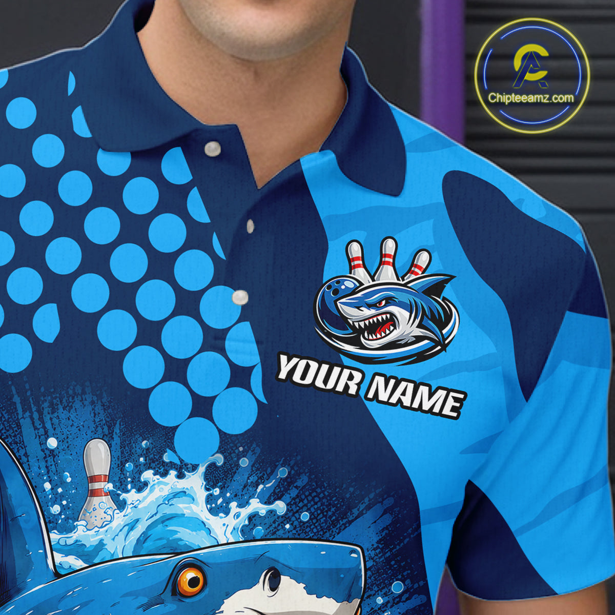 Blue and navy bowling shirt with shark design and customizable text on a person wearing it.