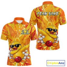 Load image into Gallery viewer, Yellow duck with sunglasses and a red ball on an orange and yellow patterned shirt with 'Chiptee Amz' branding.