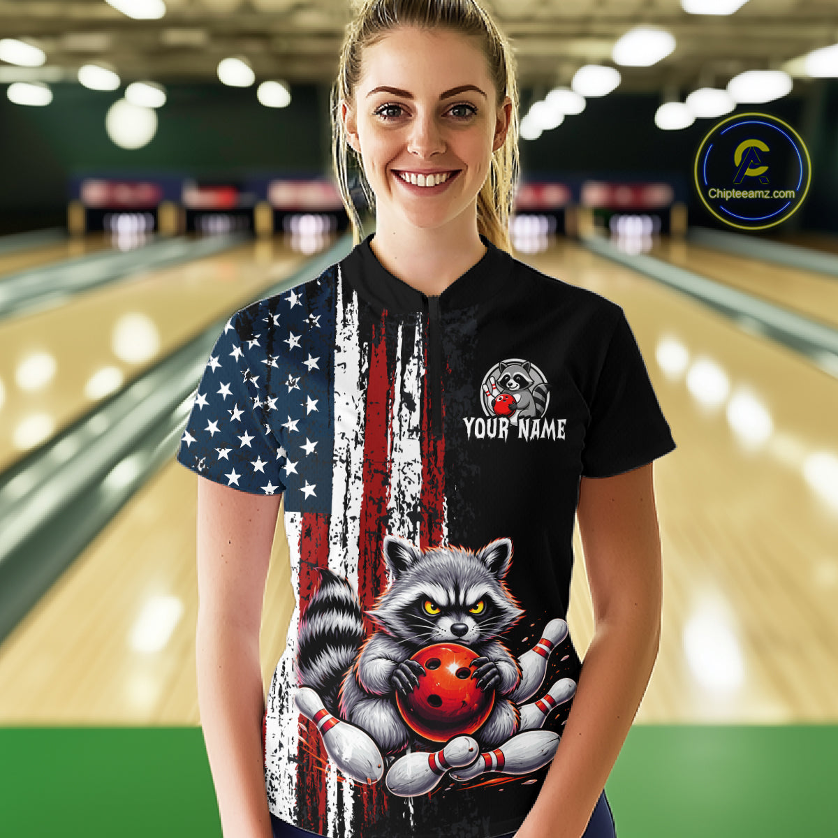 Women’s us flag raccoon bowling quarter zip shirt, front view on female model in bowling lane 